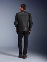 Alpinestars GP Plus R V4 Airflow Leather Jacket, Black, back view of rider wearing complete gear, features perforated leather for ventilation and red logo accents, sleek sport-fit design, paired with black pants and riding boots