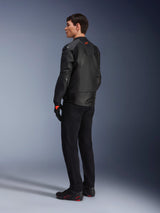 Alpinestars GP Plus R V4 Airflow Leather Jacket, Men's Sport Motorcycle Jacket, All Black, three-quarter rear view on a model, featuring perforated leather panels, red logo on the back, and integrated shoulder protection, worn with black pants and riding shoes