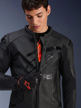 Alpinestars GP Plus R V4 Airflow Leather Jacket in Black, male model partially unzipping the front to show orange internal branding, featuring perforated leather panels and a glossy chest logo, paired with a black and red motorcycle glove