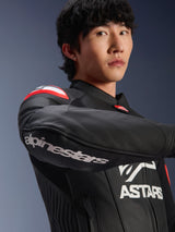 Alpinestars GP Plus R V4 Airflow Leather Jacket, Motorcycle Jacket, Black Red Fluo White, worn by model, close-up on the arm with white Alpinestars branding, red and white shoulder details, perforated leather for ventilation, professional racing-inspired design