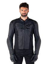 Alpinestars Faster V3 Leather Jacket, Black Motorcycle Jacket, premium leather with HRSF stretch panels, sleek sport fit, reinforced shoulders with protectors, worn with black gloves, professional gear for road riding