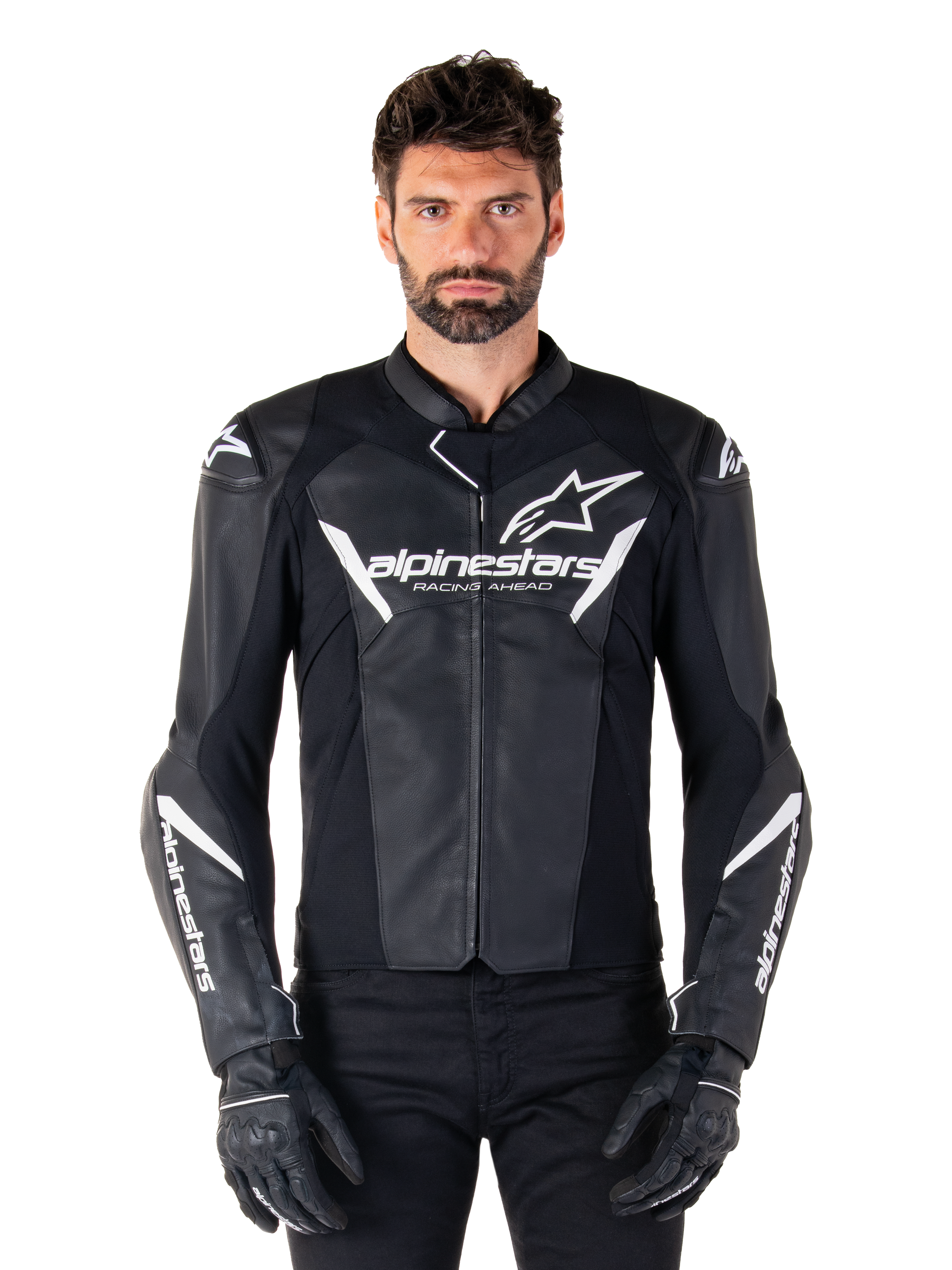 Alpinestars Faster V3 Leather Jacket, Black and White Motorcycle Racing Jacket, featuring bold white logos and 'Racing Ahead' chest text, sleek leather design with angular accents on sleeves, worn with black racing gloves