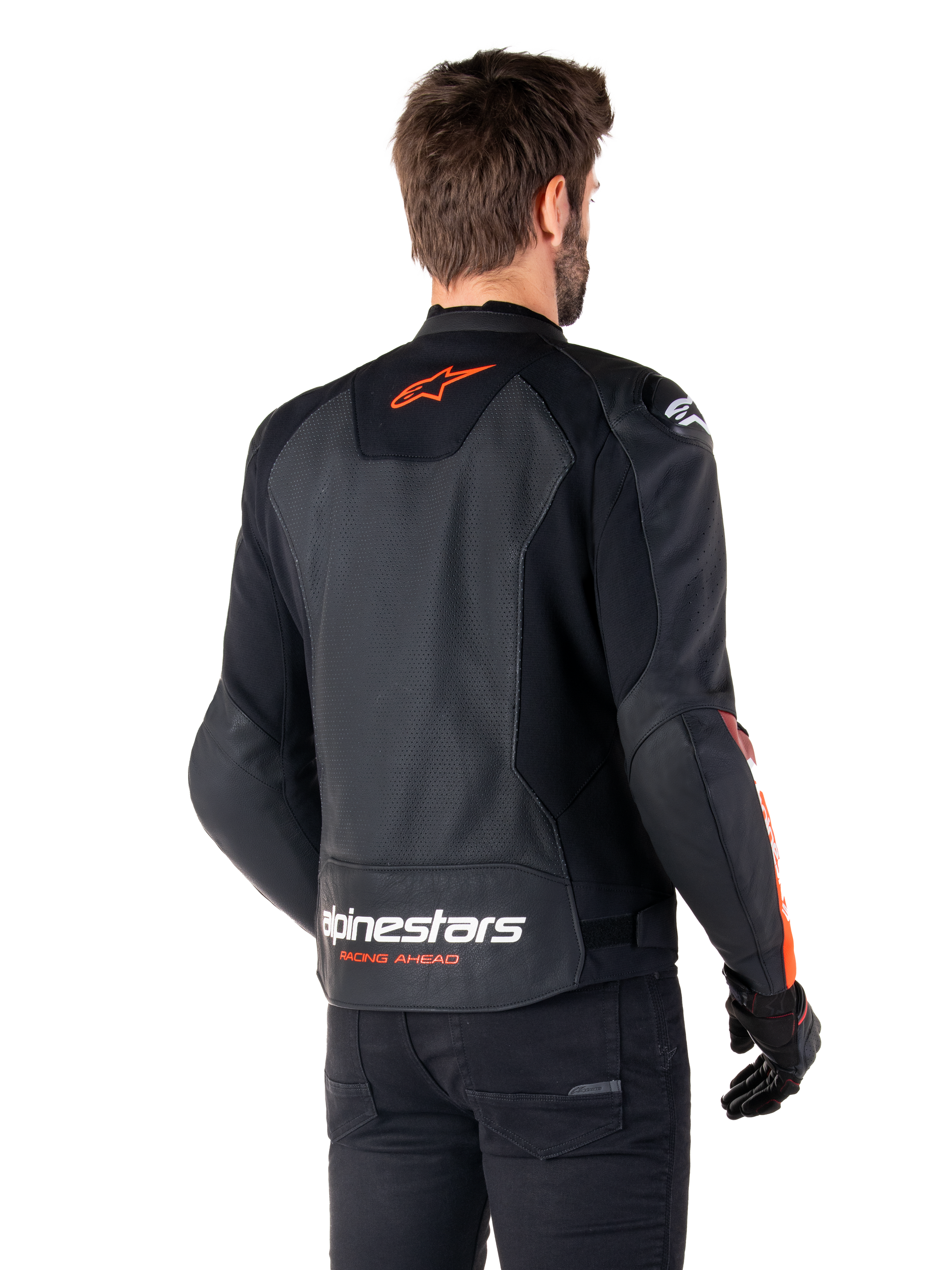 Alpinestars Faster V3 Airflow Leather Jacket, Sport Motorcycle Jacket, Black with Red Fluo, back view, featuring perforated leather panels, orange-red Alpinestars logo on upper back and white branding on the lower back, worn with black pants and gloves, sleek race-derived style