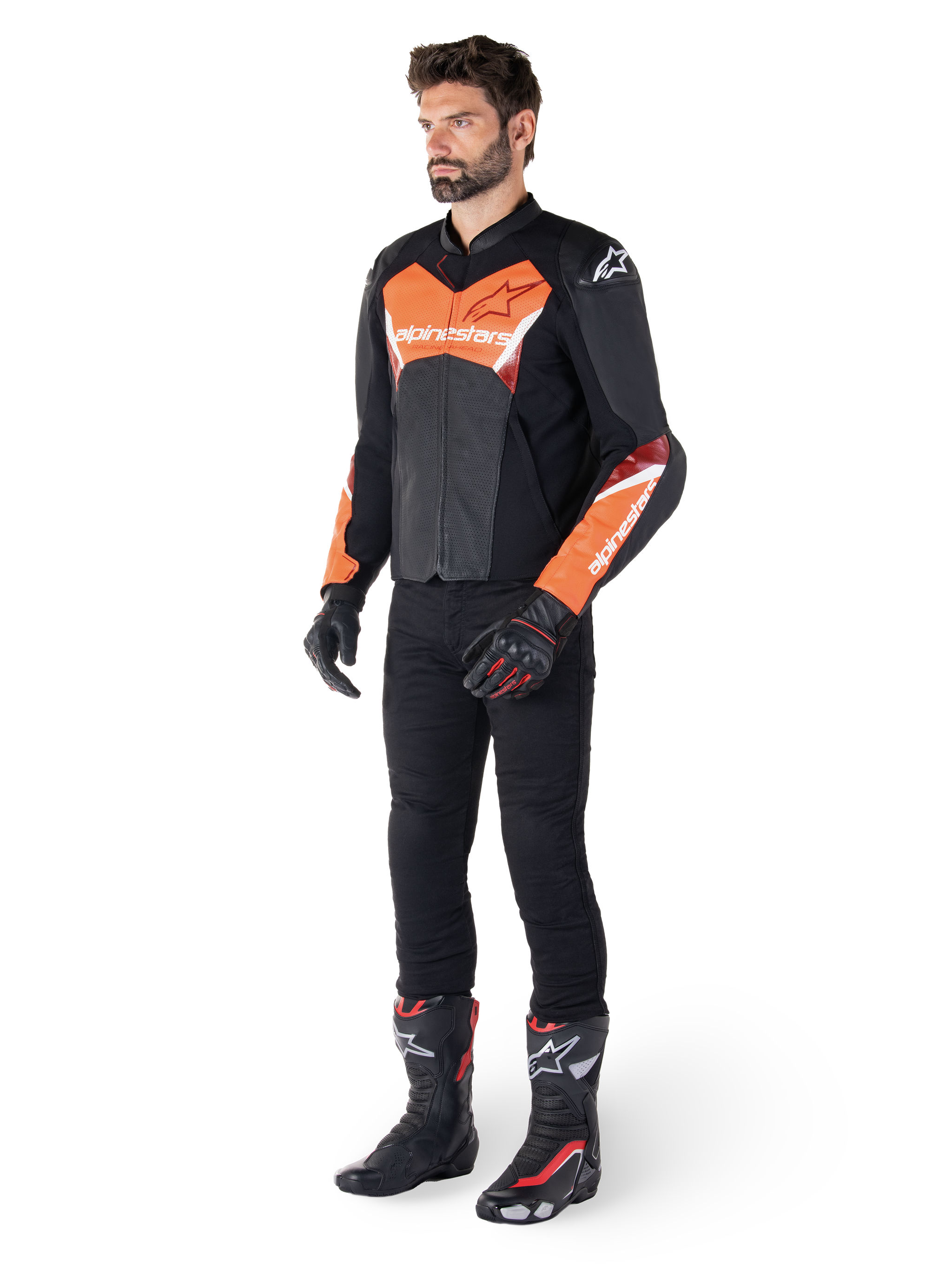 Alpinestars Faster V3 Airflow Leather Jacket, Black and Red Fluo, worn by a male model with black riding pants, gloves, and racing boots, featuring perforated leather and a sport silhouette.