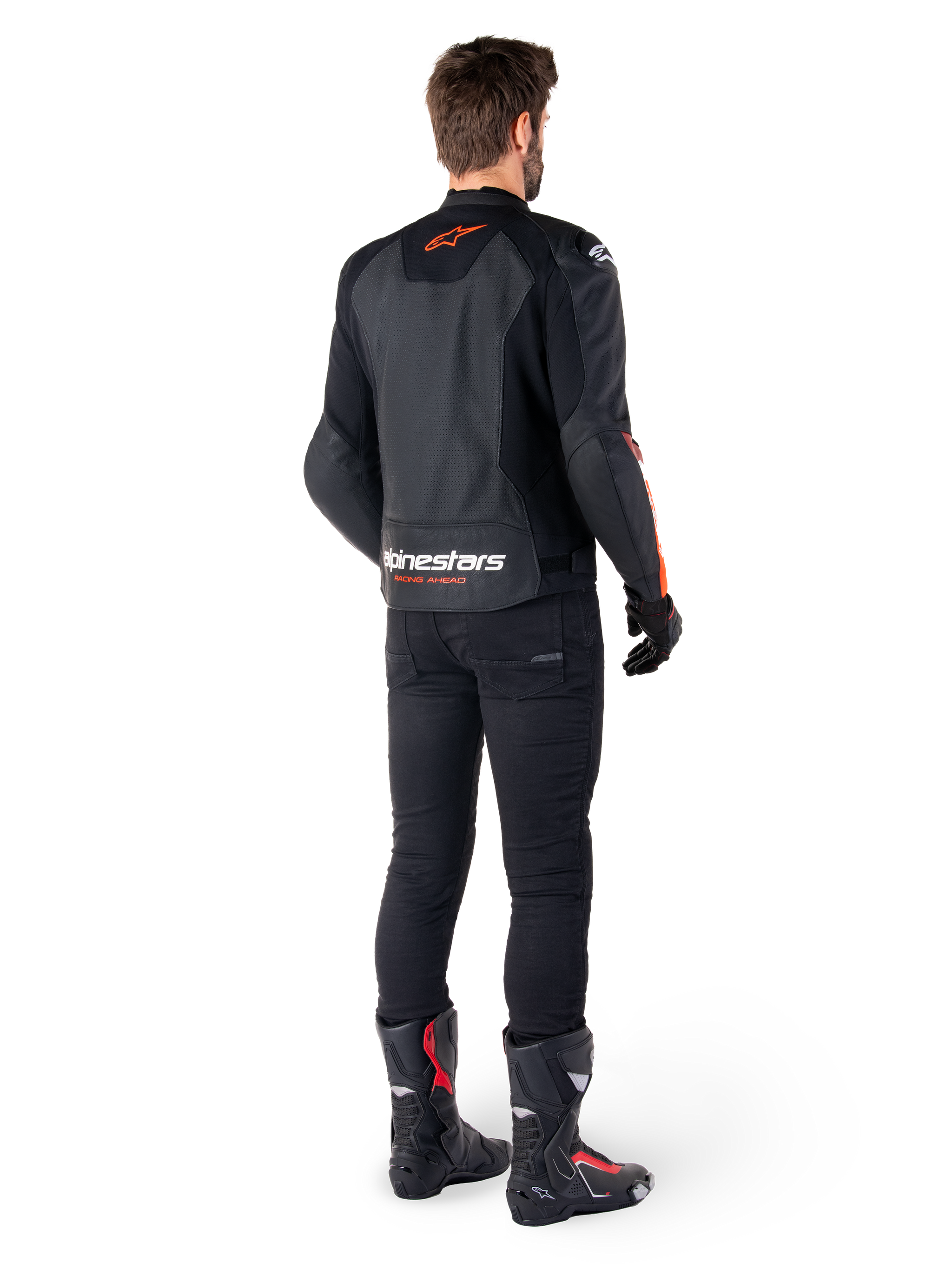 Alpinestars Faster V3 Airflow Leather Jacket, Black and Red Fluo, seen from behind on a rider, featuring perforated leather panels and bold branding, worn with black pants and motorcycle boots, sport riding attire.