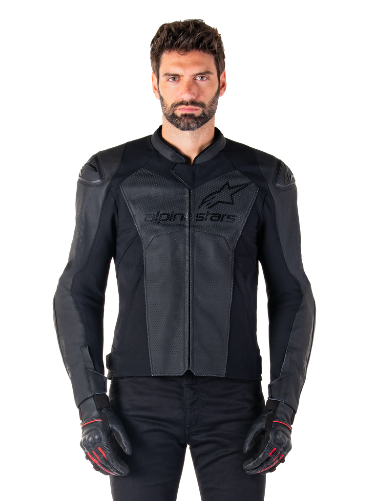 Man wearing Alpinestars Faster V3 Airflow Leather Jacket, Black motorcycle racing jacket with perforated leather panels, featuring Alpinestars logo on the chest, paired with black riding gloves, front-facing studio shot.