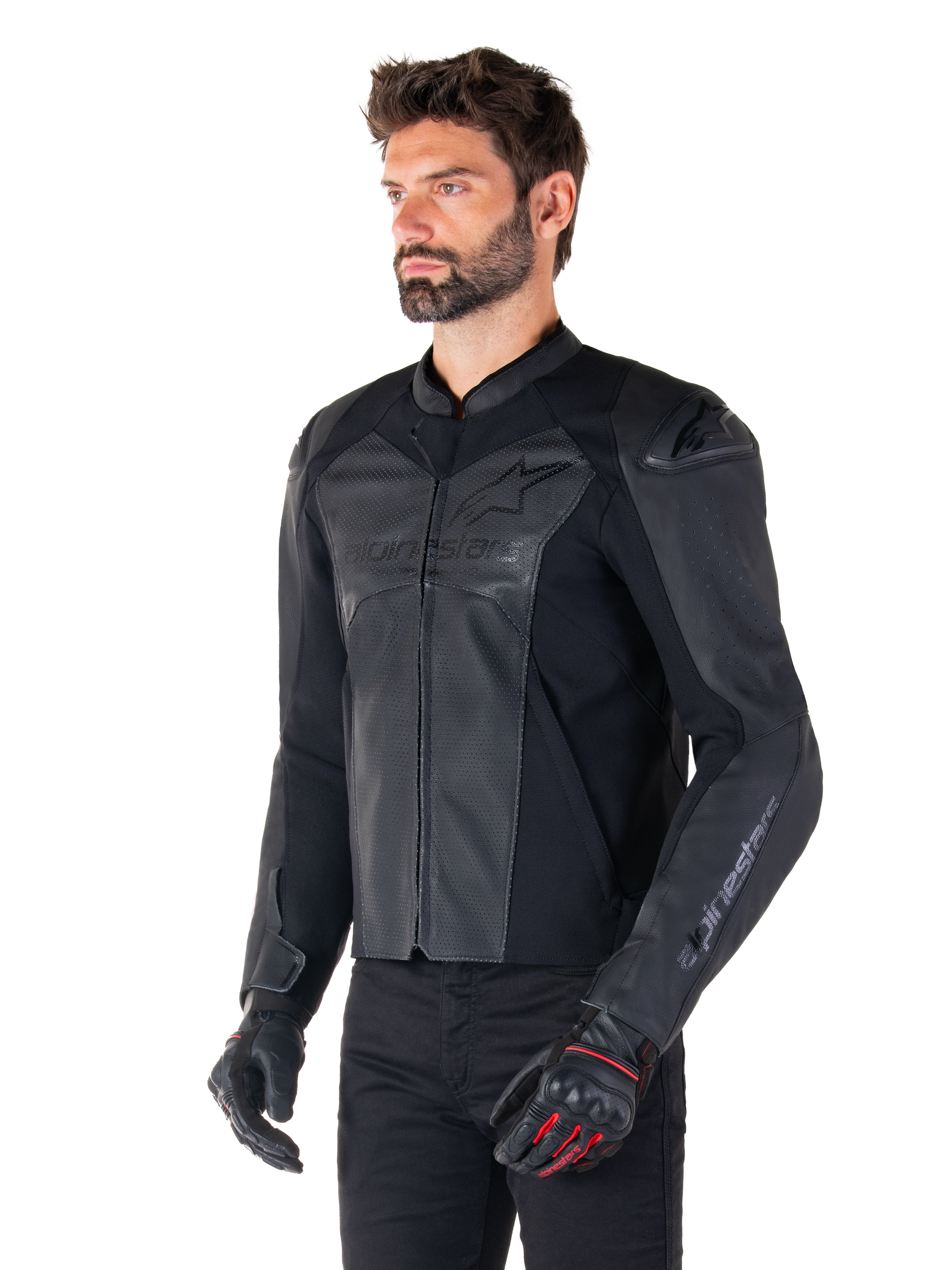 Model wearing the Alpinestars Faster V3 Airflow Leather Jacket in Black Black, sport riding motorcycle jacket with perforated leather and stretch panels, paired with black pants and black gloves with red accents, sleek race-derived style.
