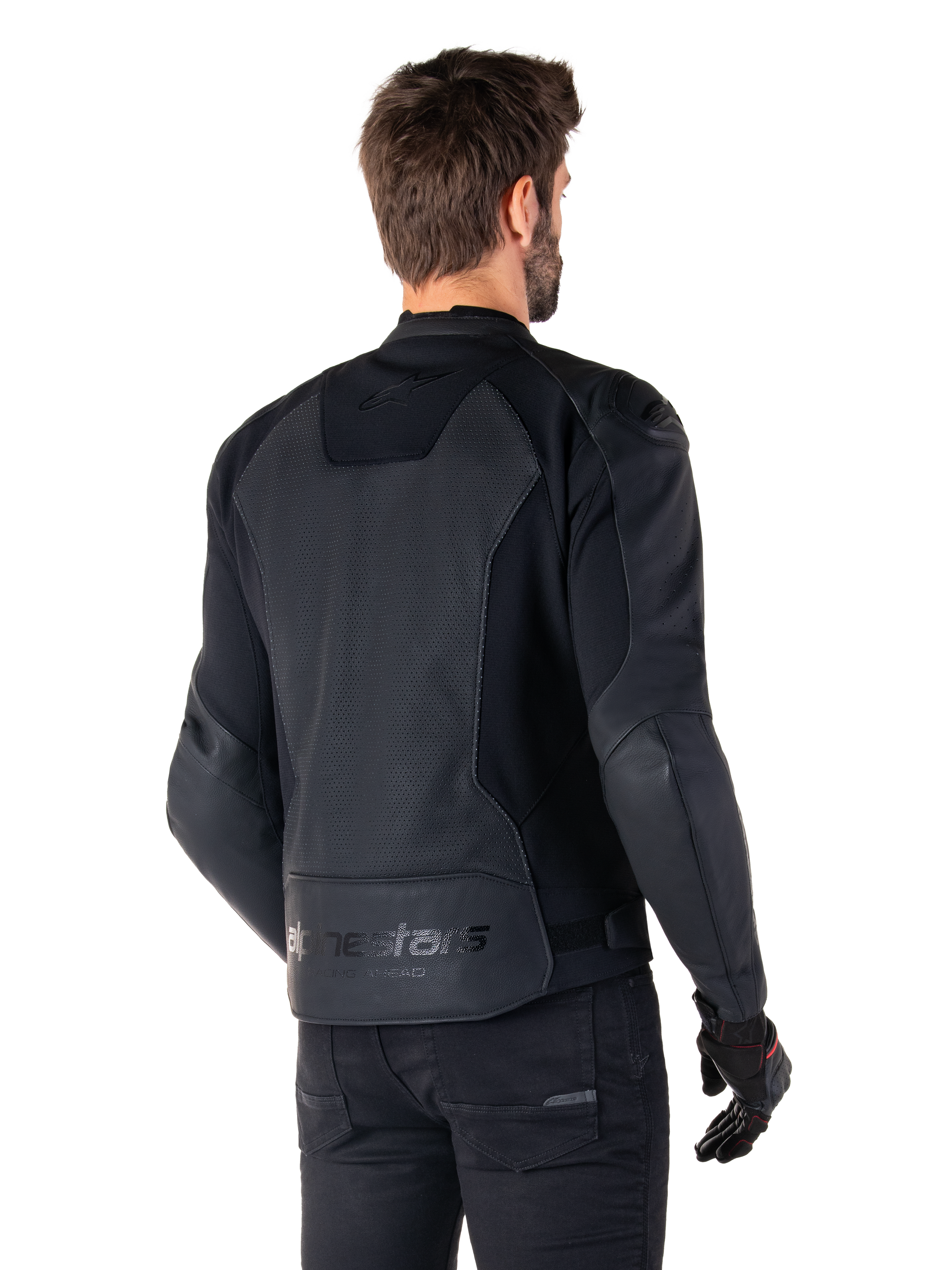 Alpinestars Faster V3 Airflow Leather Jacket, Black, Rear view of a man wearing a sport leather motorcycle jacket, featuring perforated back panels, stretch inserts, and Alpinestars branding on the lower hem, paired with black pants and gloves