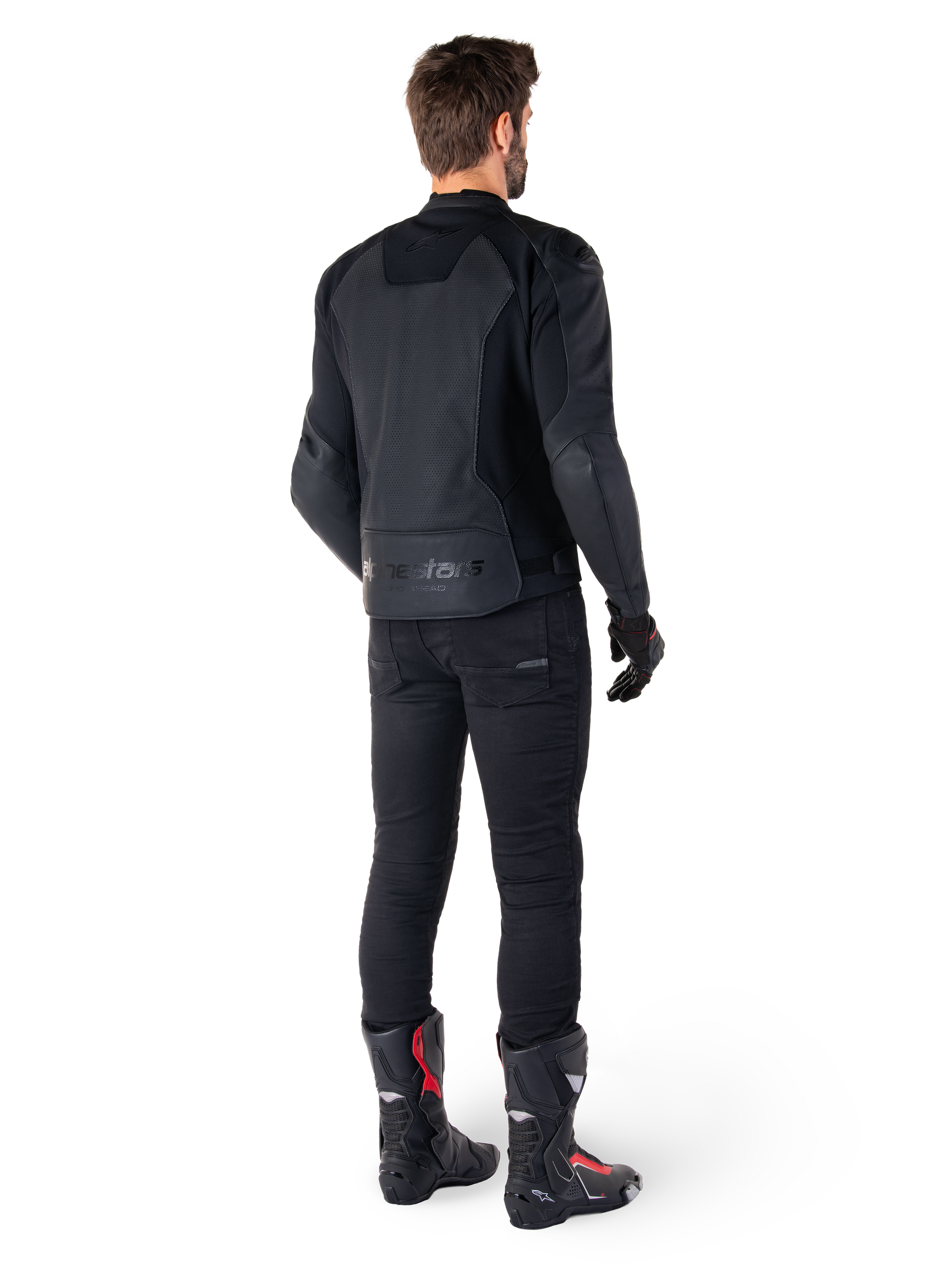 Alpinestars Faster V3 Airflow Leather Jacket, Black, Rear view of a man wearing a sport leather jacket with perforated back panels and Alpinestars branding, styled with black riding pants and black and red boots.