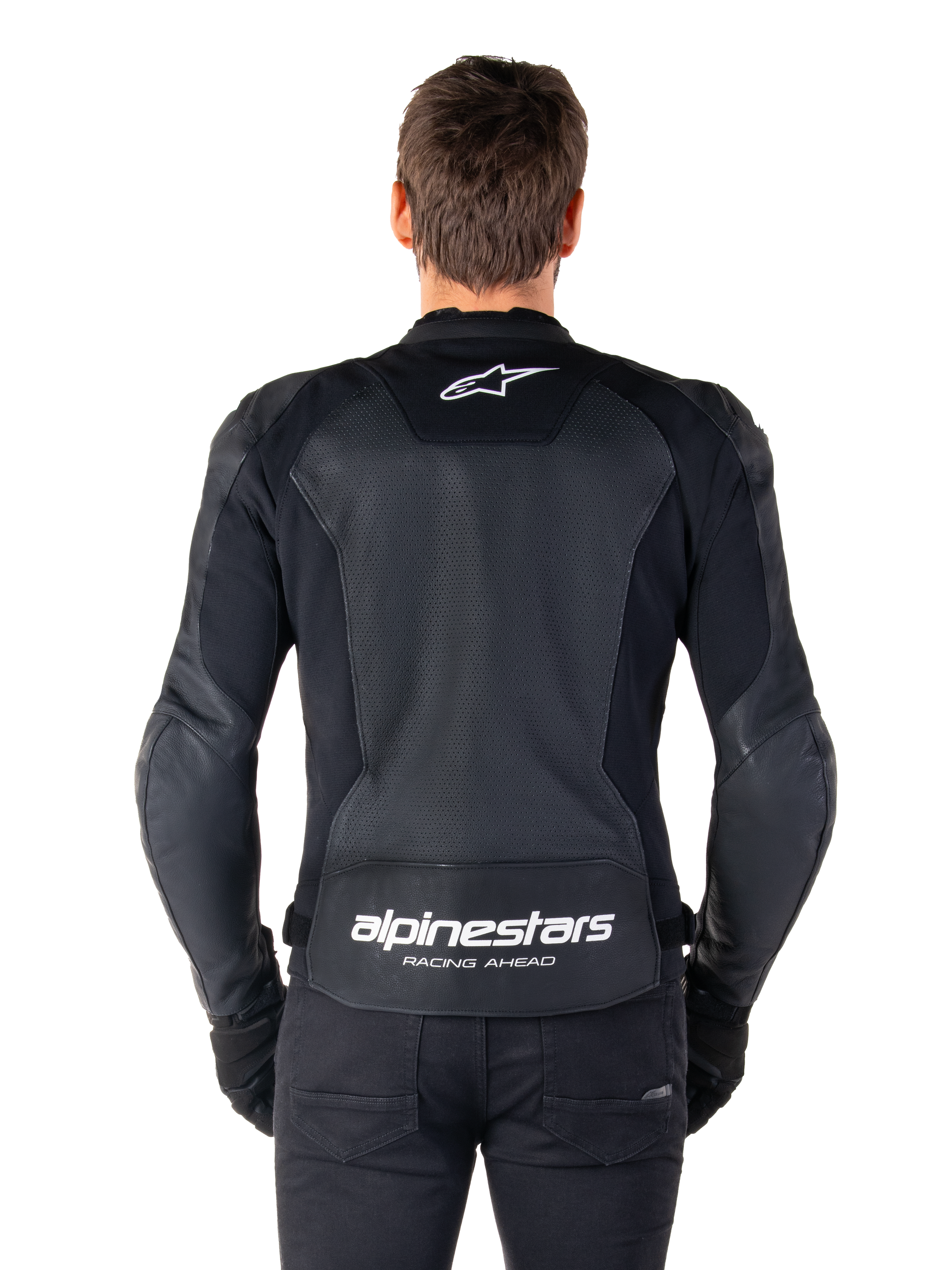 Alpinestars Faster V3 Airflow Leather Jacket, Black and White, rear view of a rider showing the perforated leather back panel for ventilation, white Alpinestars logo on upper back and 'RACING AHEAD' branding on lower back, sport-fit motorcycle gear.