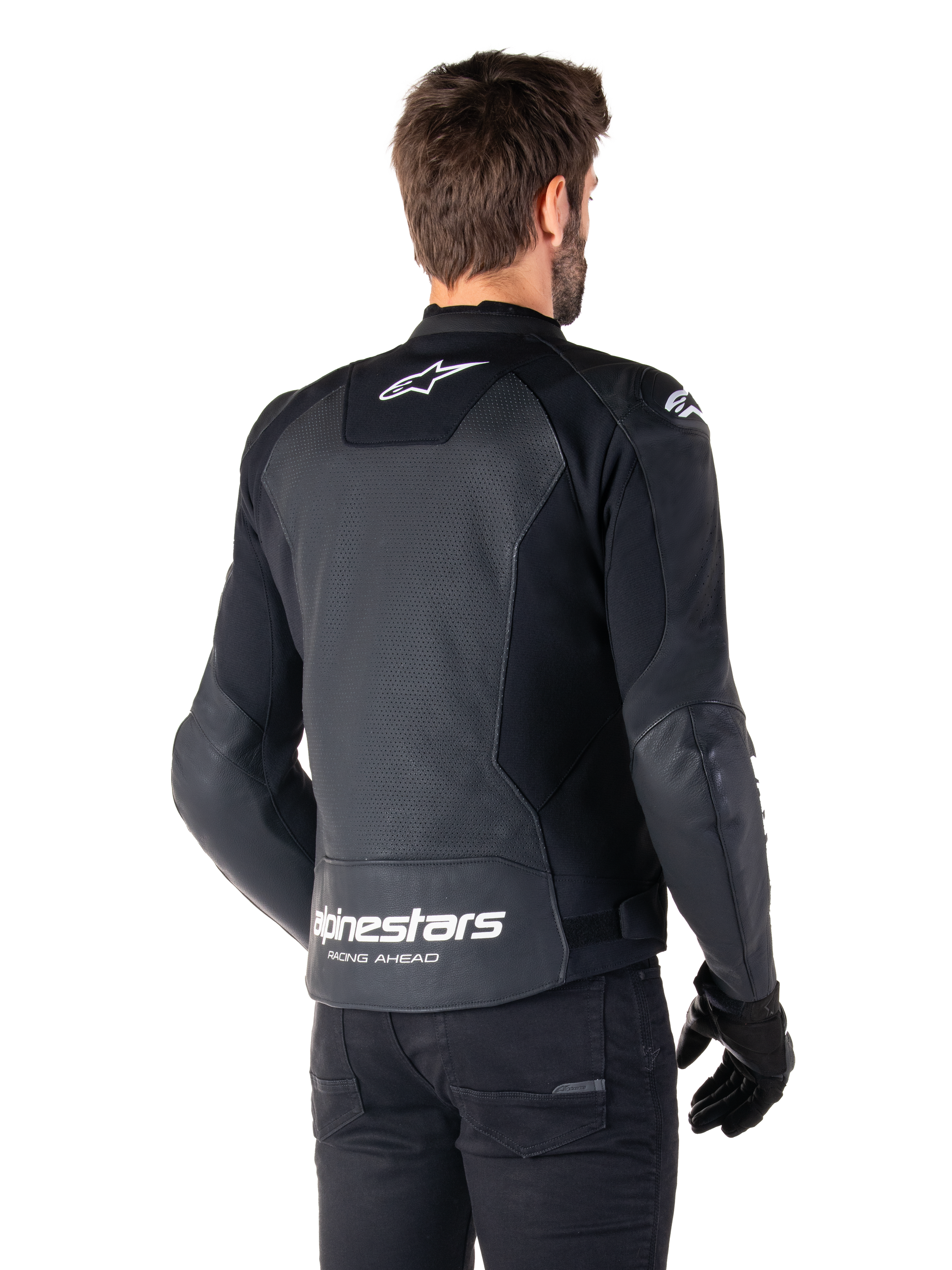 Alpinestars Faster V3 Airflow Leather Jacket, Black and White, rear view on a model, featuring perforated leather back for ventilation, white Astars logos on the upper back and lower waist with 'Racing Ahead' text, sporty design with stretch panels for motorcycling.