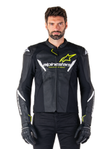 Alpinestars Faster V3 Airflow Leather Jacket, Black White and Yellow Fluo, worn by a male model with matching black gloves, featuring perforated leather panels for ventilation and bold Alpinestars branding on the chest, sport motorcycle riding gear