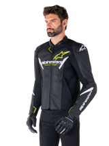 Alpinestars Faster V3 Airflow Leather Jacket, Sport Motorcycle Jacket, Black White and Yellow Fluo, worn by a man, featuring perforated leather for airflow, Alpinestars logos on chest and arms, paired with black gloves.