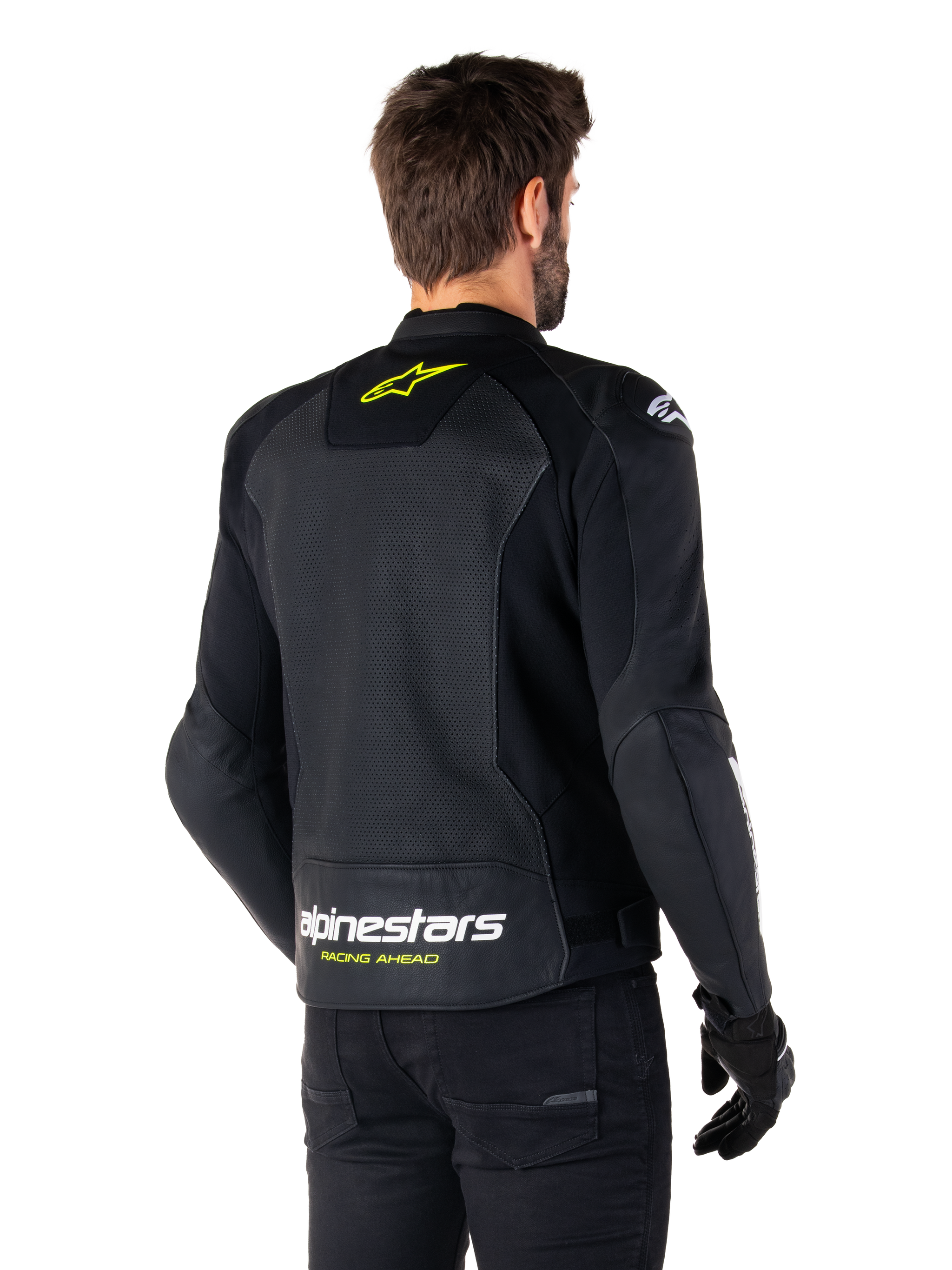 Alpinestars Faster V3 Airflow Leather Jacket, Black White and Yellow Fluo, rear view, featuring a large perforated leather back panel for ventilation, yellow star logo on the collar, and white Alpinestars branding with yellow 'Racing Ahead' text on the lower hem, sport motorcycle riding gear