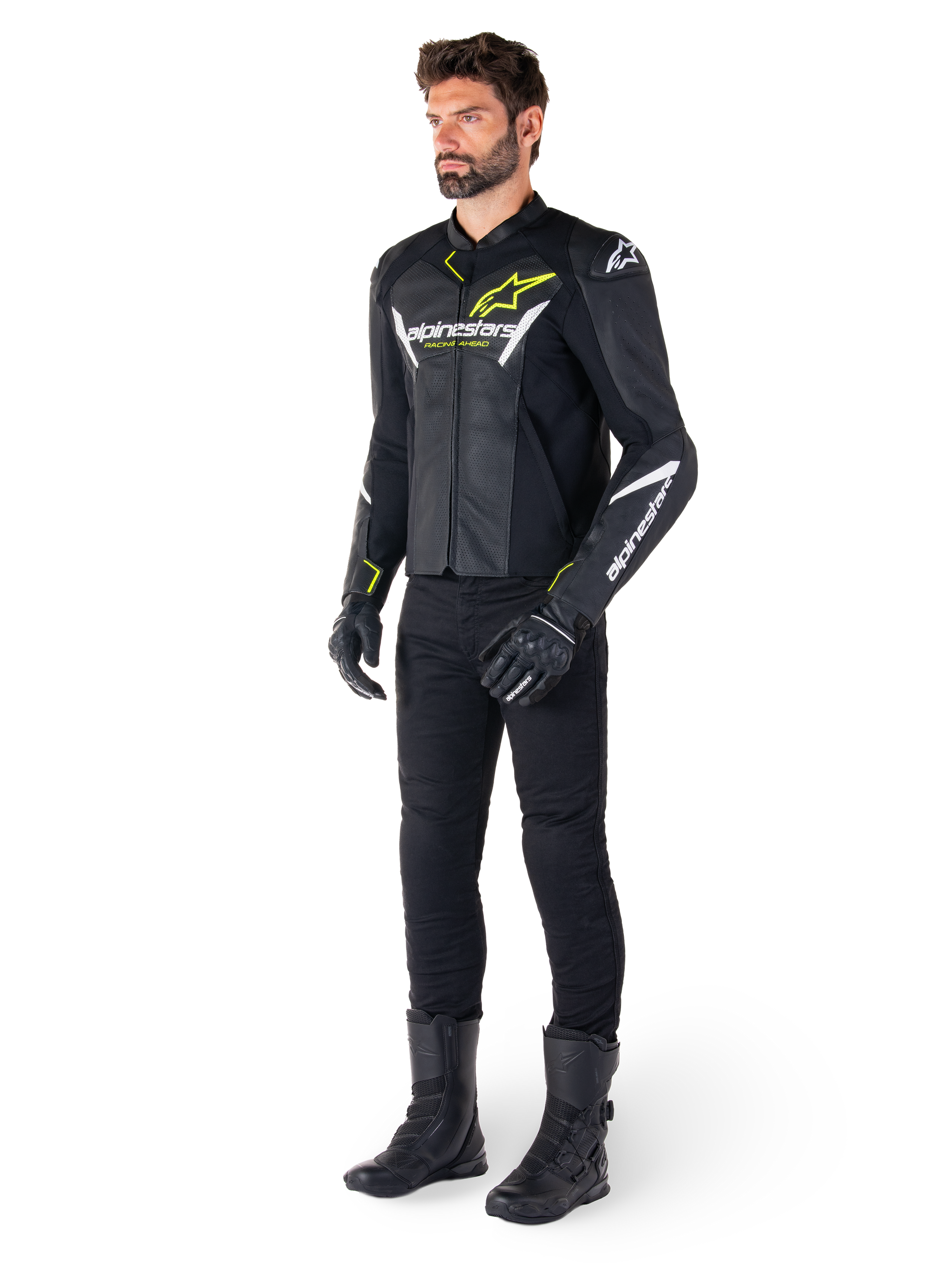 Male rider wearing the Alpinestars Faster V3 Airflow Leather Jacket in Black White and Yellow Fluo, paired with black motorcycle pants and boots, featuring perforated leather panels, white logo details, and neon yellow accents, professional sport riding gear