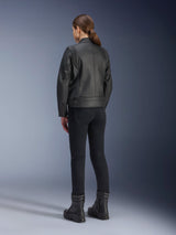 Alpinestars Stella Dyno Leather Jacket, Women's Motorcycle Jacket, Black, rear view showing premium leather construction and tailored fit, worn with black riding pants and black boots, urban riding style.