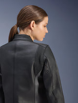Stella Dyno Leather Jacket, Women's Motorcycle Jacket, Black, close-up back view featuring accordion stretch panels behind the shoulder and metal ventilation eyelets, premium bovine leather construction with a clean heritage-inspired design.
