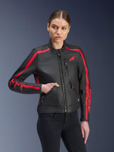 Alpinestars Stella Dyno Leather Jacket, Women's Motorcycle Jacket, Black Haute Red, worn by a model with black jeans, featuring red racing stripes on shoulders and sleeves with bold branding, premium leather construction, heritage-inspired design for urban riding