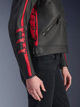 Alpinestars Stella Dyno Leather Jacket, Women's Motorcycle Jacket, Black and Haute Red, side view worn by a model, featuring red racing stripes with star logos on the sleeve and a large red logo on the side, premium bovine leather, urban riding style