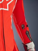 Alpinestars GP Tech V5 One Piece Leather Suit, Red Fluo and Bright Red, close-up of the sleeve featuring Tech-Air indicator and protective sliders, perforated leather with white accents, professional racing gear detail