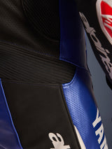 Close-up detail of the Alpinestars Yamaha GP-R7 One Piece Leather Suit, Metallic Blue and Black, featuring perforated leather panels for ventilation, black accordion stretch inserts for flexibility, and bold white Yamaha branding, highlighting the race-grade bovine leather construction.