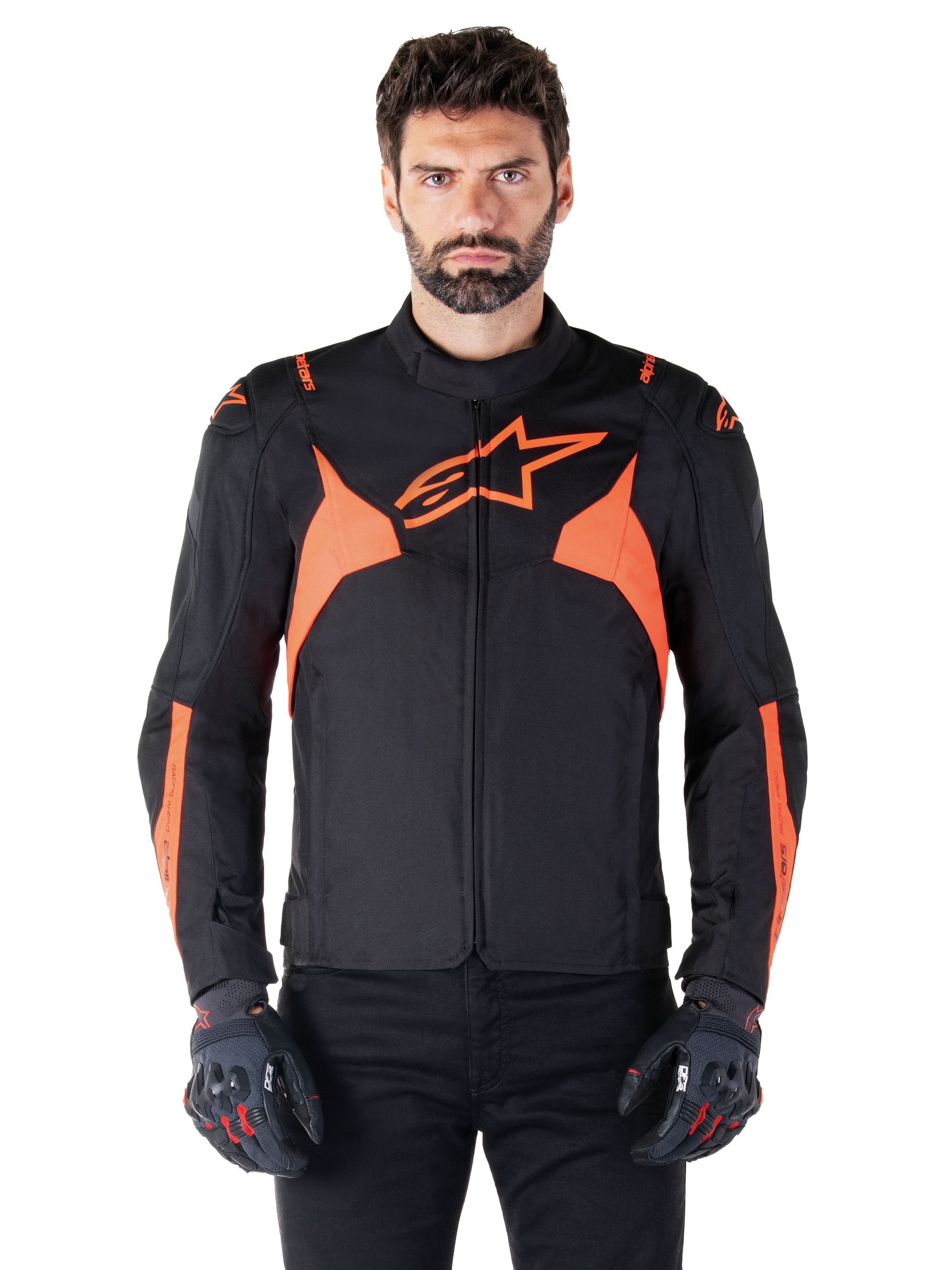 Alpinestars T-Jaws V4 Waterproof Jacket, Motorcycle Sport Jacket, Black and Red Fluo, featuring neon accents and a prominent star logo on the chest, worn by a male model with black riding gloves, sleek racing-inspired textile design