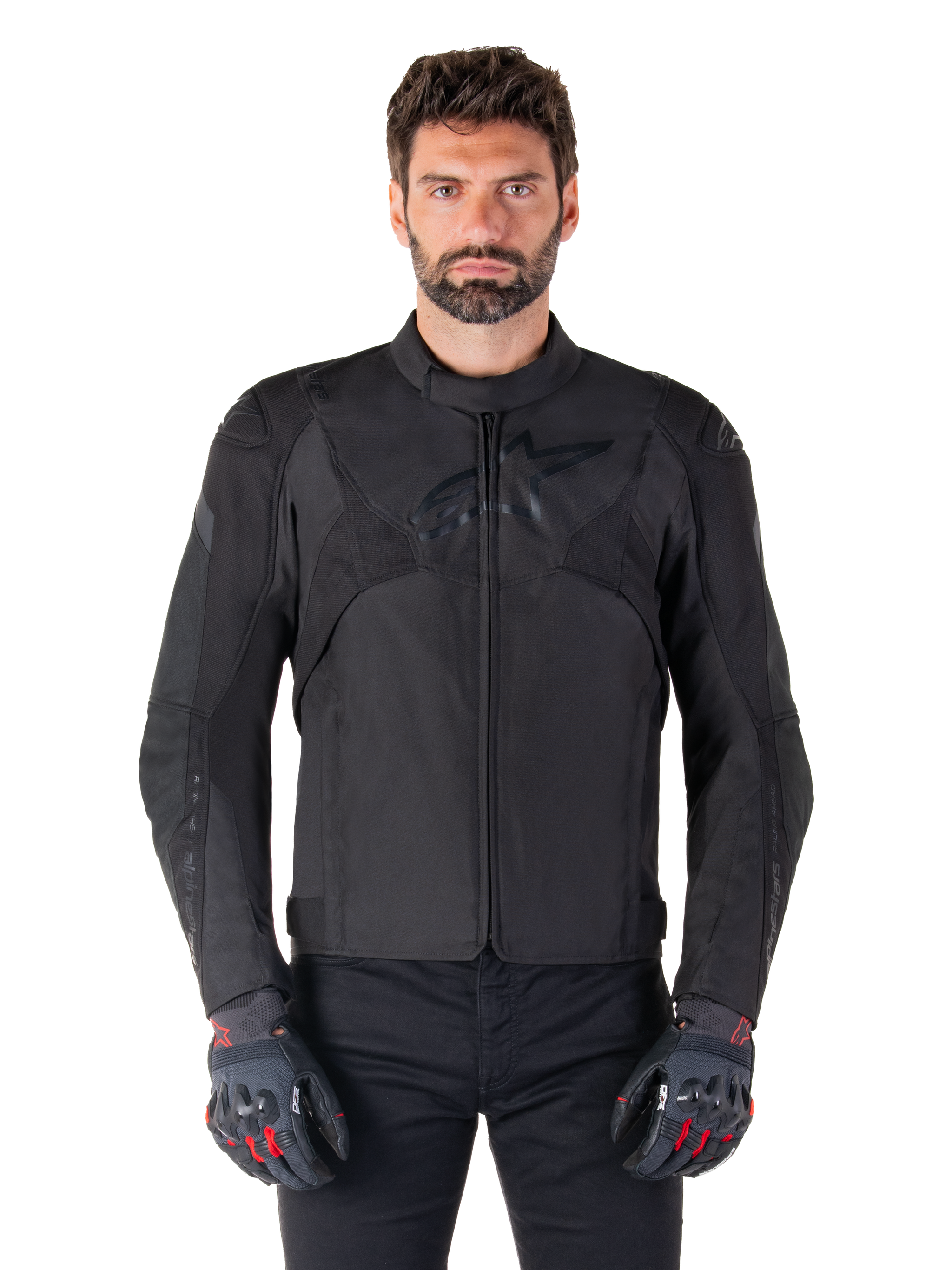 Alpinestars T-Jaws V4 Waterproof Jacket, Black Motorcycle Sport Jacket, worn by a man with black gloves featuring red accents, reinforced shoulders and arms, sleek design with subtle chest logo, textile all-weather riding gear