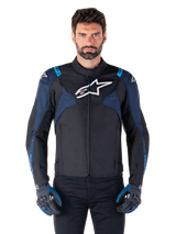 Alpinestars T-Jaws V4 Waterproof Jacket, Motorcycle Jacket, Black and Dark Blue with Blithe Blue accents, white logo on chest, blue text on shoulders, worn with matching gloves, waterproof textile riding gear