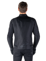 Alpinestars T-SPS V2 Waterproof Jacket, Black, back view showing the sport cut silhouette, reflective Alpinestars logo on the lower back, and extended back for extra coverage while riding.