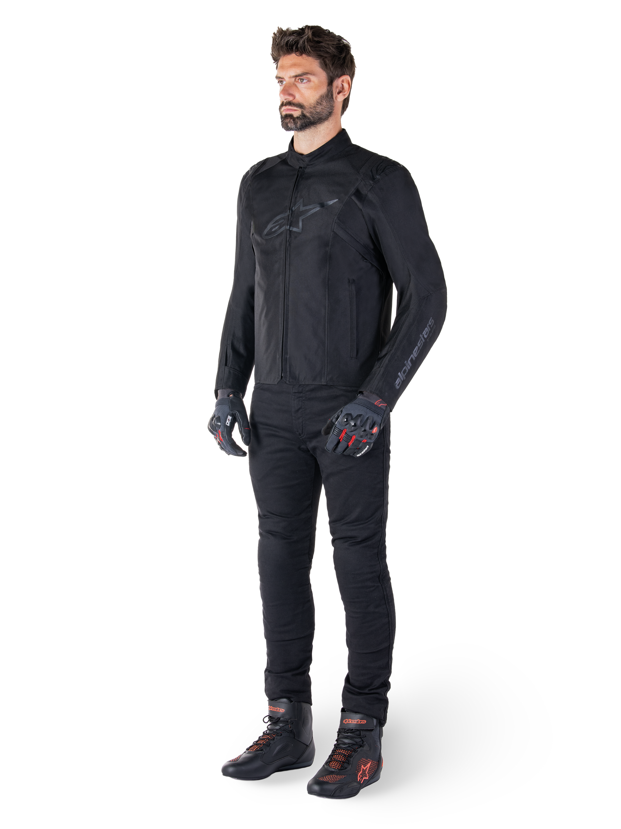 Alpinestars T-SPS V2 Waterproof Jacket, Black, worn by a male model with matching black pants, black gloves with red accents, and black riding shoes, full motorcycle gear for urban and sport riding, clean white background