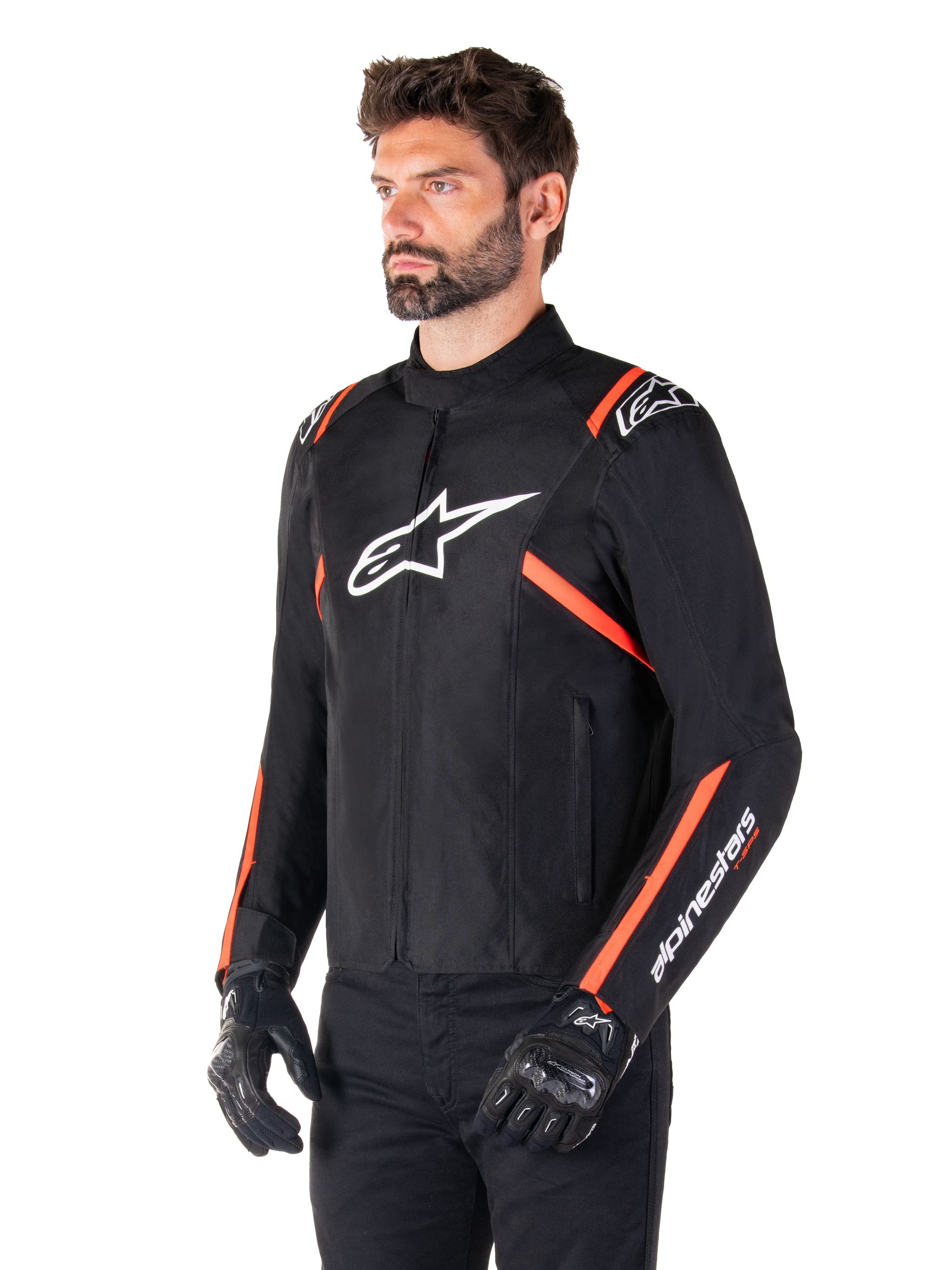 Alpinestars T-SPS V2 Waterproof Jacket, Black White and Red Fluo, worn by a male model with black gloves and pants, featuring a white Alpinestars logo on the chest and fluorescent red accents on the shoulders and sleeves, sporty textile design