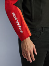 Alpinestars T-SPS V2 Waterproof Jacket, Motorcycle Jacket, Black and Red, close-up of the sleeve featuring a white vertical brand logo on a red panel, durable textile construction with a sport-inspired design.