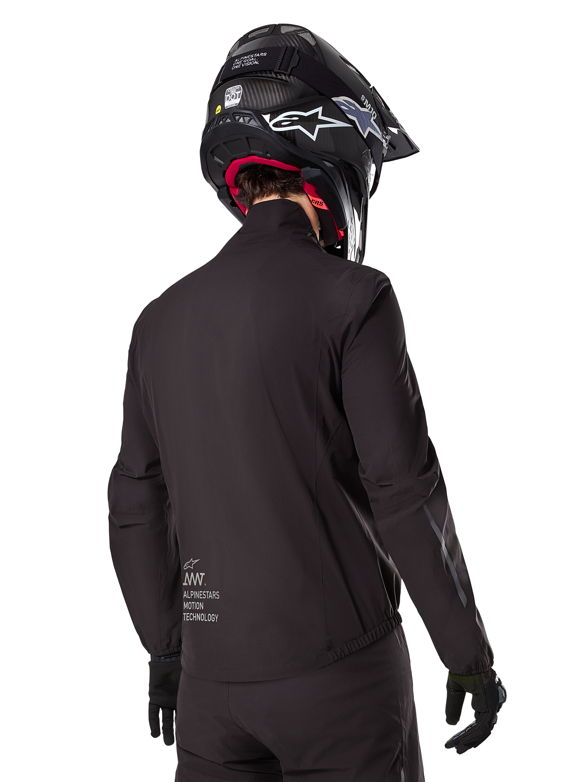 Alpinestars AMT-8 Stretch Drystar® XF Liner, Black Waterproof Jacket Liner, rear view on a rider wearing a black helmet and gloves, featuring Alpinestars Motion Technology branding on the lower back, minimalist and functional design for adventure riding.