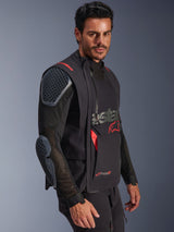 Alpinestars Halo Pro Drystar® XF Laminated Jacket, Black and Dark Shadow, adventure motorcycle jacket worn by model, modular configuration featuring mesh sleeves with integrated shoulder and elbow armor, red logo accents and technical waterproof zippers.