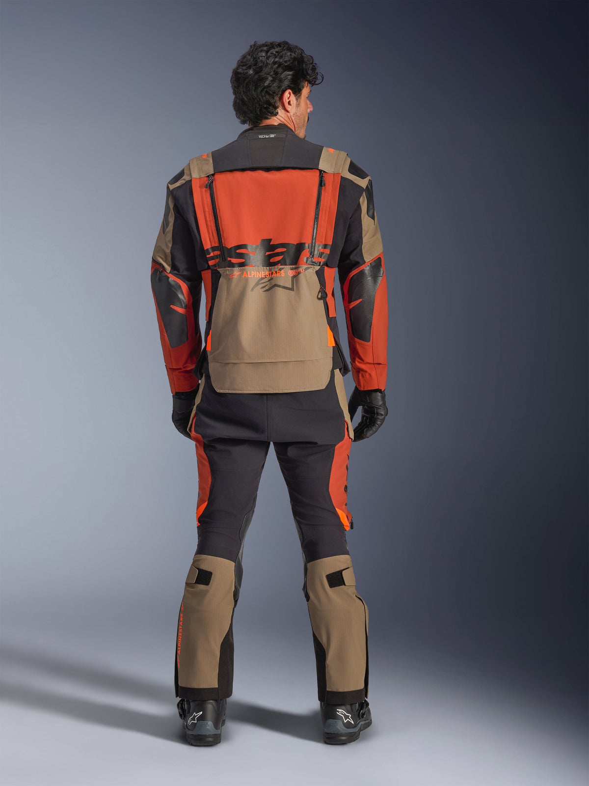 Alpinestars Halo Pro Drystar® XF Laminated Jacket, Walnut Rust Black, rear view, adventure touring jacket with modular design and large waterproof back pocket, worn with matching technical pants.