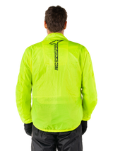 Alpinestars Hurricane Rain V2 Jacket, Motorcycle Rain Jacket, Yellow Fluo, rear view showing vertical black Alpinestars logo on center back, lightweight waterproof fabric, worn with black riding pants and gloves