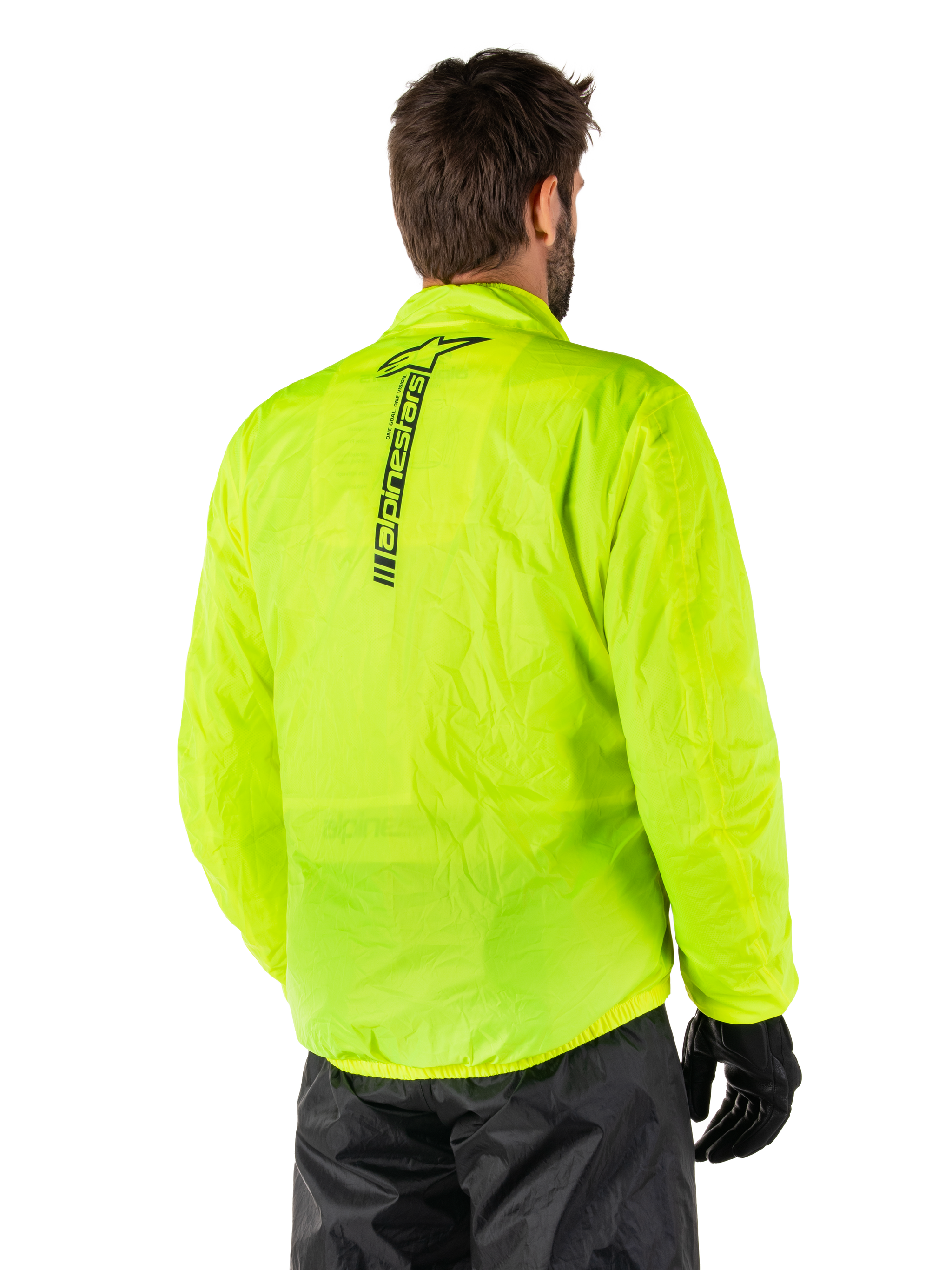 Alpinestars Hurricane Rain V2 Jacket, Yellow Fluo, rear view worn by male model, featuring vertical black Alpinestars wordmark on center back, elasticated waist and cuffs, waterproof and packable design