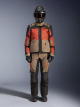 Alpinestars Andes V4 Drystar® Jacket, men's adventure touring motorcycle textile jacket in walnut rust and black, front view on a model wearing matching adventure pants, helmet, goggles, and gloves.