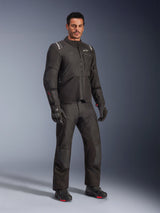 Alpinestars Andes V4 Drystar® Jacket, Black motorcycle gear set, worn by a model, adventure-touring textile jacket and pants, black gloves and boots, studio shot, sleek modern design for all-weather riding