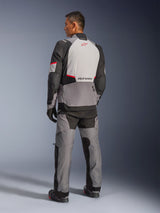 Alpinestars Andes V4 Drystar® Jacket, Dark Gray and Ice Gray with Black and Bright Red accents, back view showing light gray panel with red star logo, paired with matching adventure pants and black gloves, technical all-weather motorcycle gear.