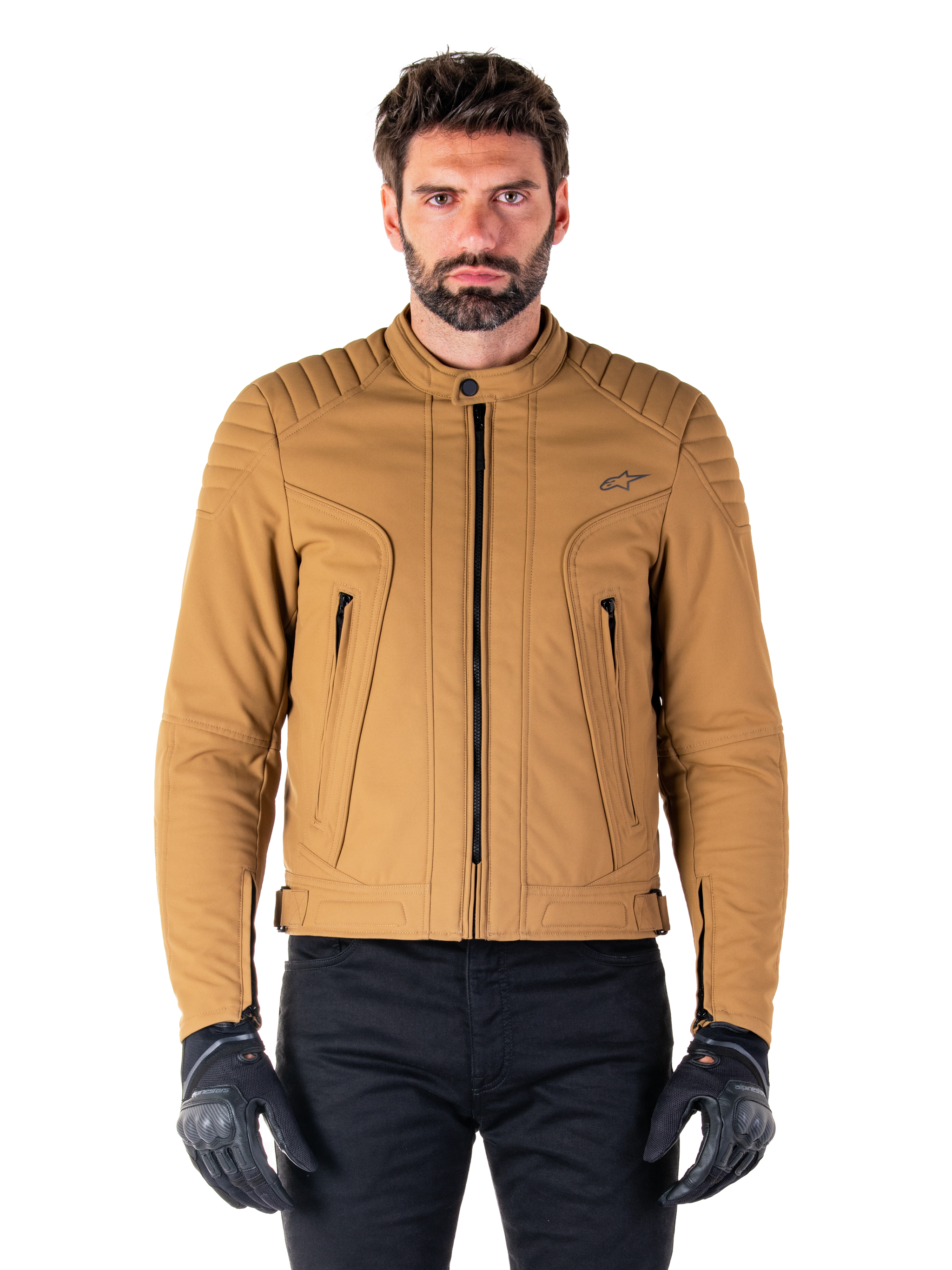 Alpinestars Clayton WR Jacket, Urban Motorcycle Jacket, Utility Brown Light Gold, water-resistant textile with quilted padded shoulders, high biker collar, black zipper details, and chest logo, worn with black protective gloves and pants