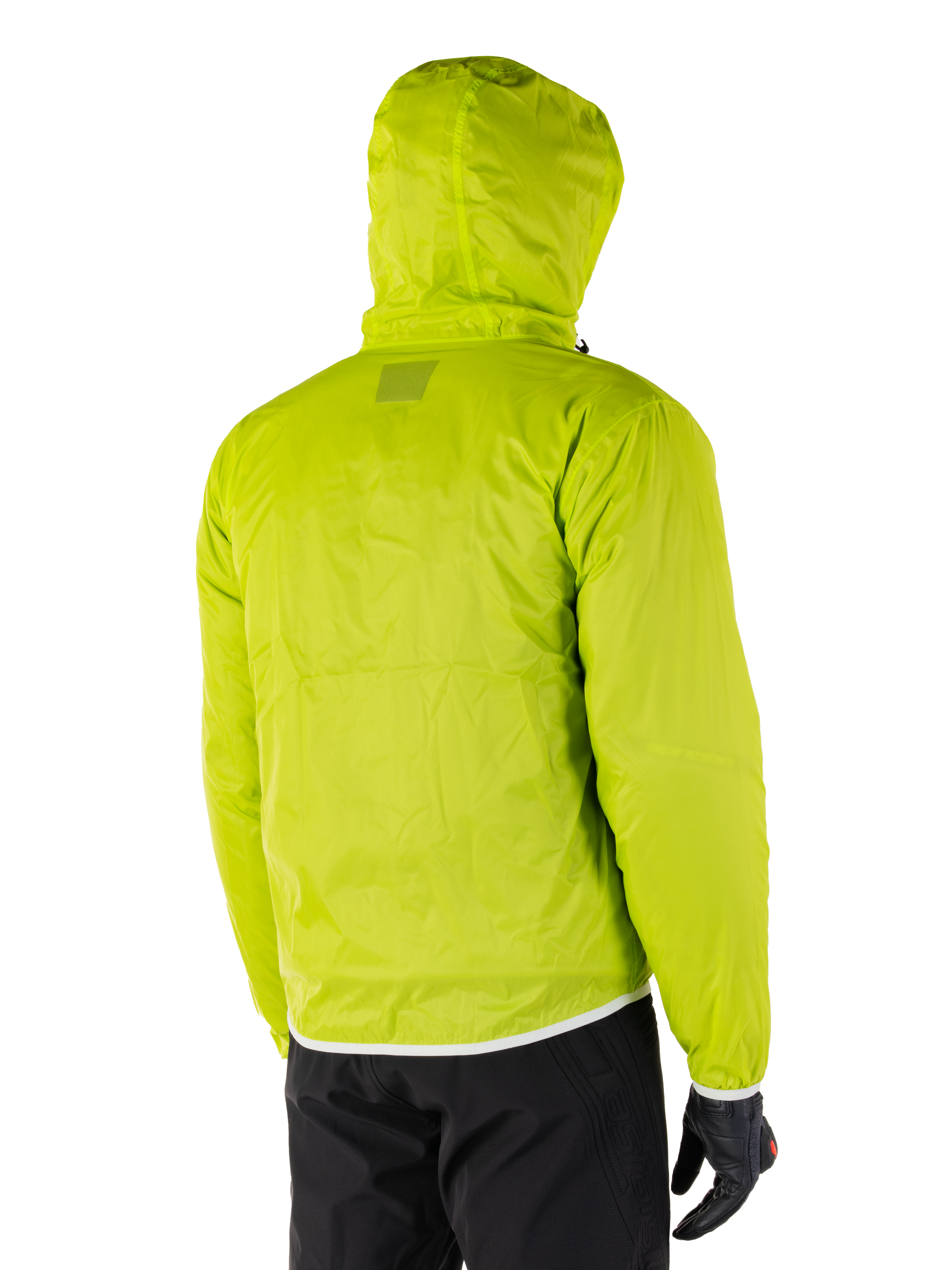 Alpinestars Mohobbs Waterproof Jacket, packable rain liner in Lime Punch, rear view of the hooded neon green waterproof layer, worn with black motorcycle pants and gloves