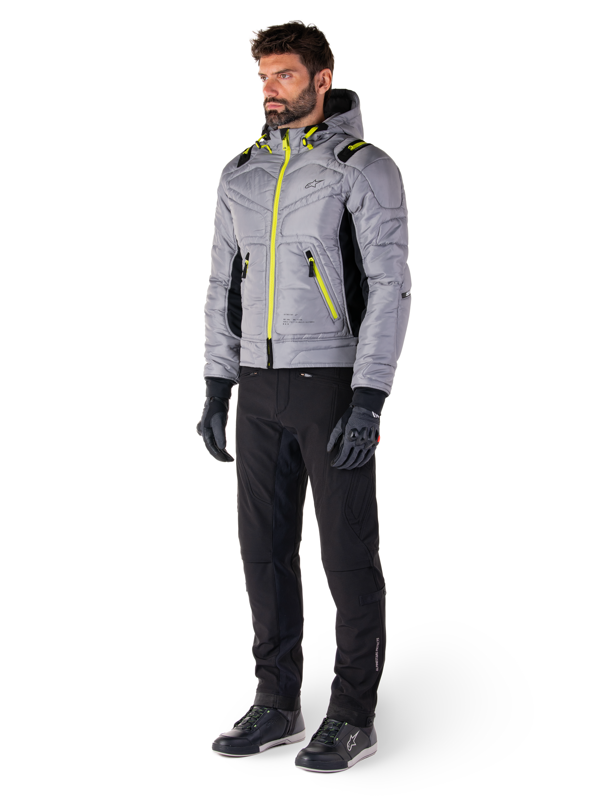 Alpinestars Mohobbs Waterproof Jacket in Lunar Gray and Lime Punch, quilted bomber-style motorcycle jacket with neon accents, worn by model with black riding pants and gloves, urban streetwear-inspired protective gear