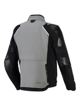Alpinestars Andes Pro Drystar® XF Jacket, Adventure Motorcycle Jacket, Dark Gray and Black, back view featuring a large rear storage compartment with zippers, adjustable sleeve straps, and Tech-Air branding on the collar, durable textile shell design