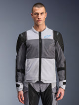 Alpinestars ST-2 Air Jacket, Men's Motorcycle Jacket, Ice Gray and Dark Gray with Black accents, wide mesh ventilation panels, laser-perforated front, blue Alpinestars logo, front zipper, worn by a model with matching riding pants