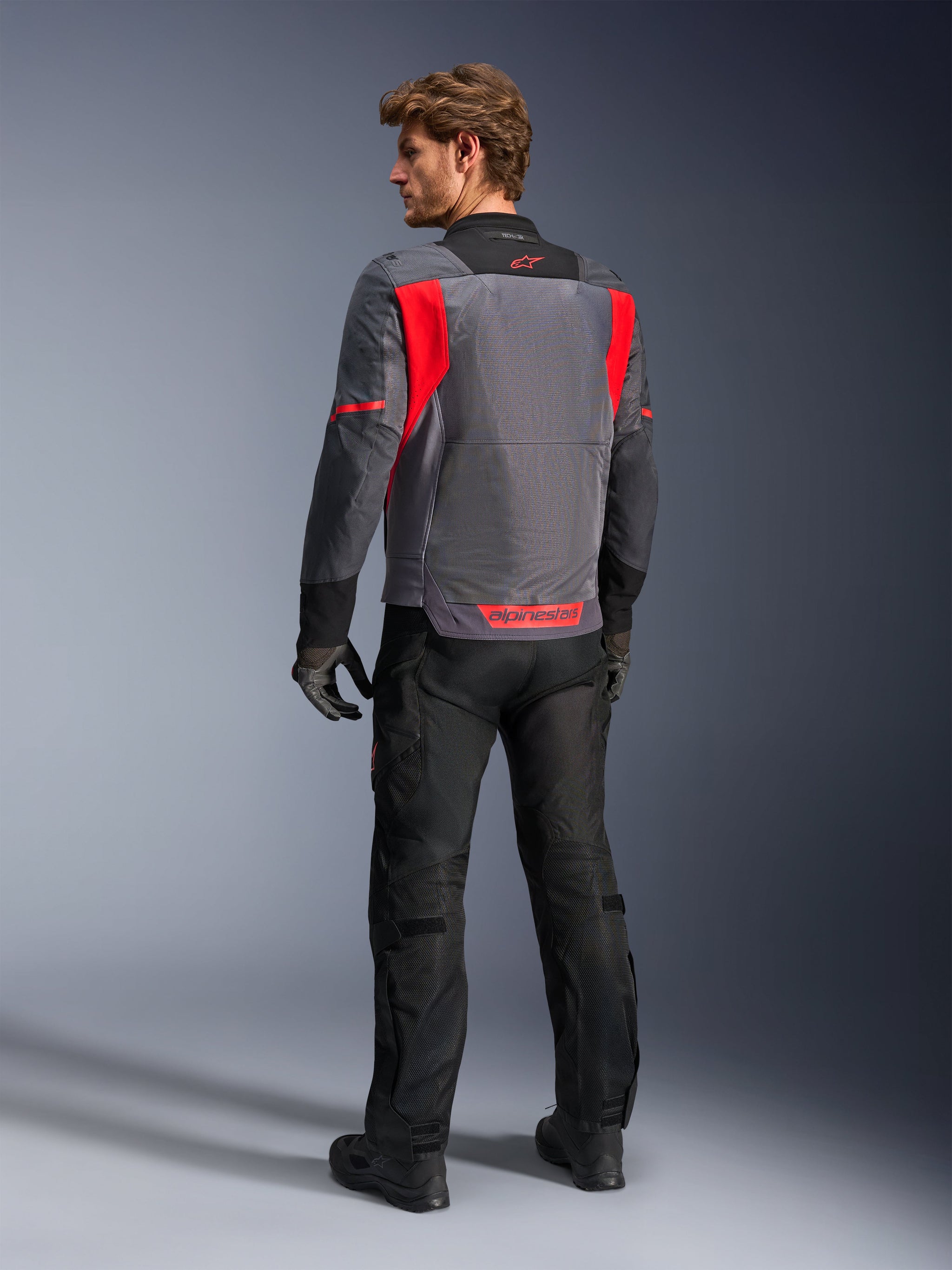 Alpinestars ST-2 Air Jacket for men in Gray and Red, with a mesh back panel for ventilated summer adventure touring.