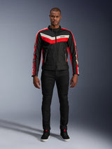 Alpinestars T-Dyno WR Jacket, textile motorcycle jacket in Black Bright Red and Ecru, featuring V-shaped chest stripes and star branding on the sleeves, worn with black pants and black riding shoes, heritage-inspired urban gear