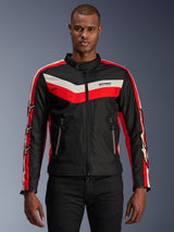 Alpinestars T-Dyno WR Jacket, Textile Motorcycle Jacket, Black with Bright Red and Ecru Chevron Stripes, vintage-inspired biker fit, high collar with button closure, zippered front pockets, star logos on sleeves, worn by model