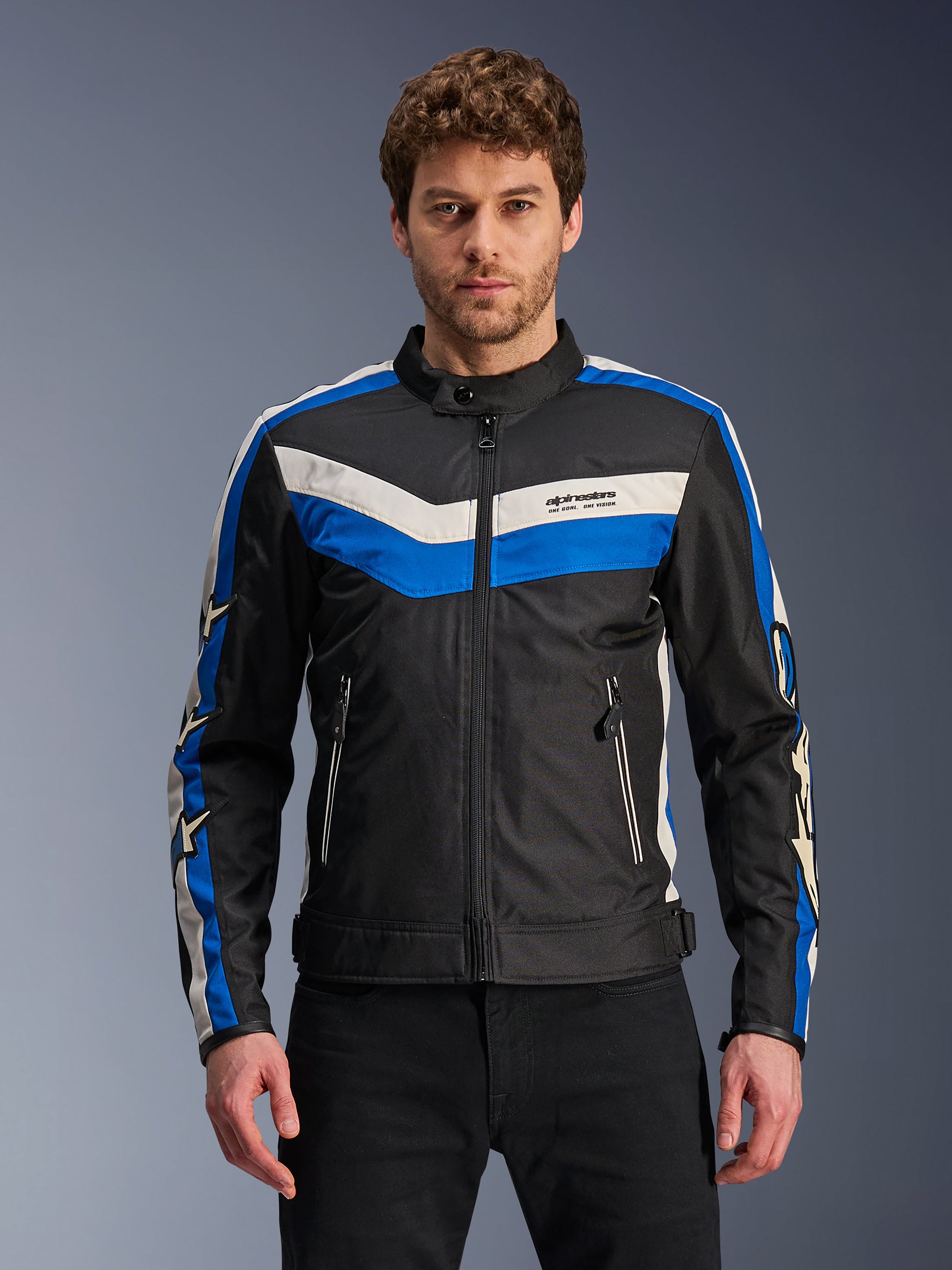 Alpinestars T-Dyno WR Jacket, Black with Blue and Ecru White stripes, Men's textile motorcycle jacket, featuring a chevron chest design and star logos on the sleeves, zippered front and pockets, heritage-inspired urban gear
