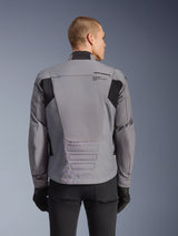 Alpinestars SMX Waterproof Jacket, Gray with black accents, back view showing upper back branding and elongated rear profile, worn by a model with black pants and gloves